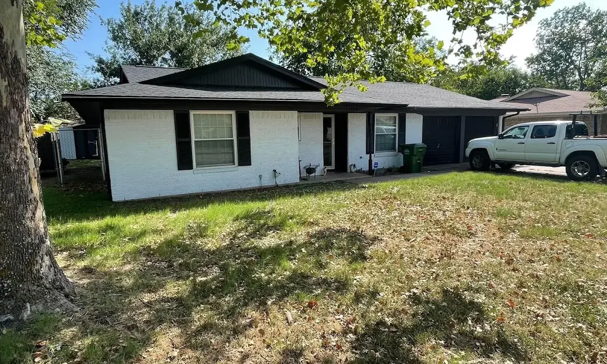 Professional roofing crew working on a residential roof in Canonsburg